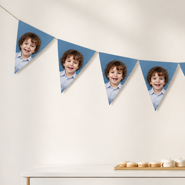 Custom face bunting banner displayed above an elegant personalized dessert table